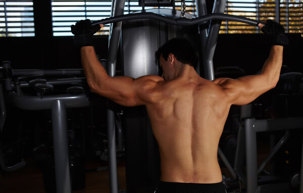 Muscular build athlete exercising