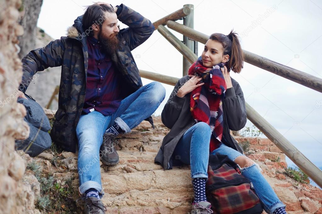 hikers resting while out hiking in mountains