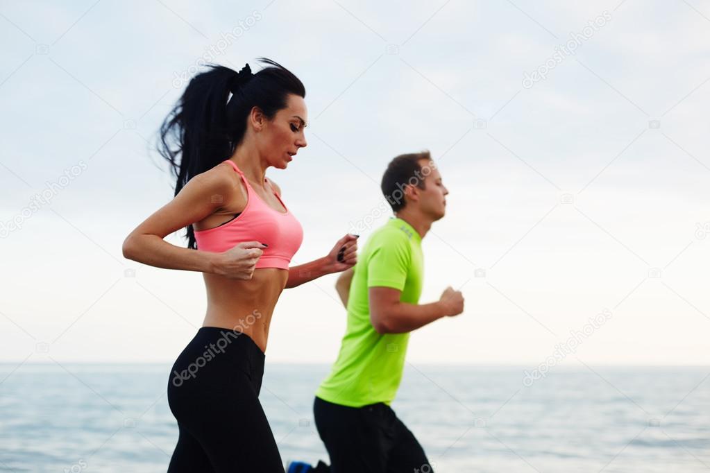 couple  working out on the beach