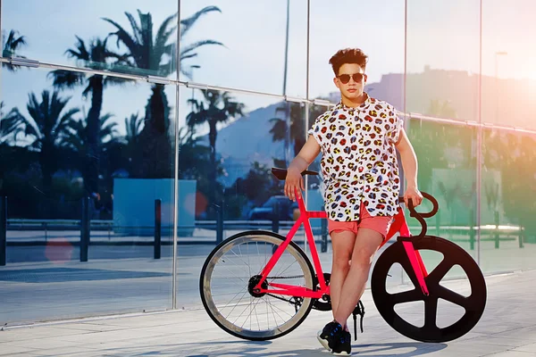 Hipster man standing with bike — Stock Photo, Image