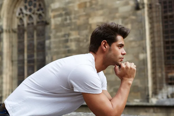 Man resting chin on clasped hands — Stock Photo, Image