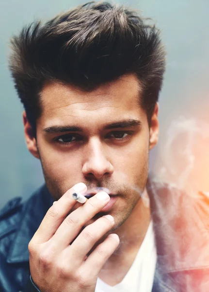 Man exhaling cigarette smoke — Stock Photo, Image