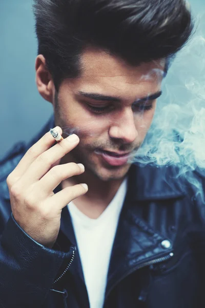 Man exhaling cigarette smoke — Stock Photo, Image