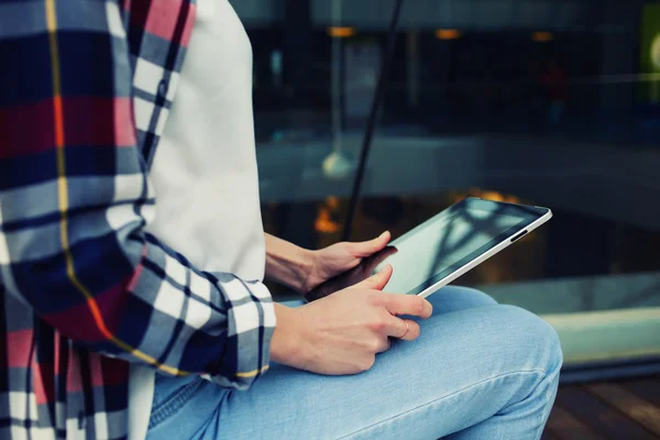 Woman's hands hold black tablet — Stock Photo, Image