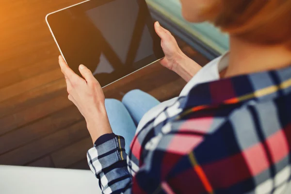 Woman's hands hold black tablet — Stock Photo, Image