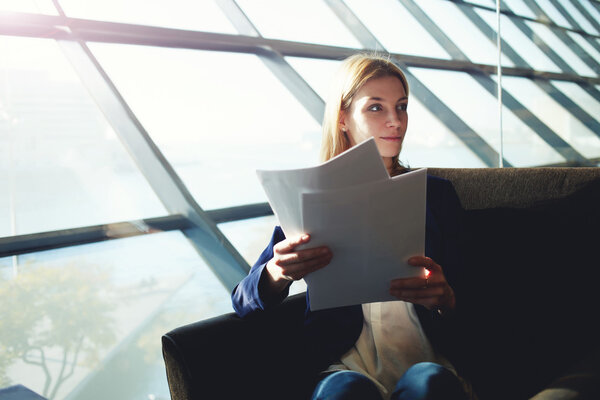 Business woman examining paperwork