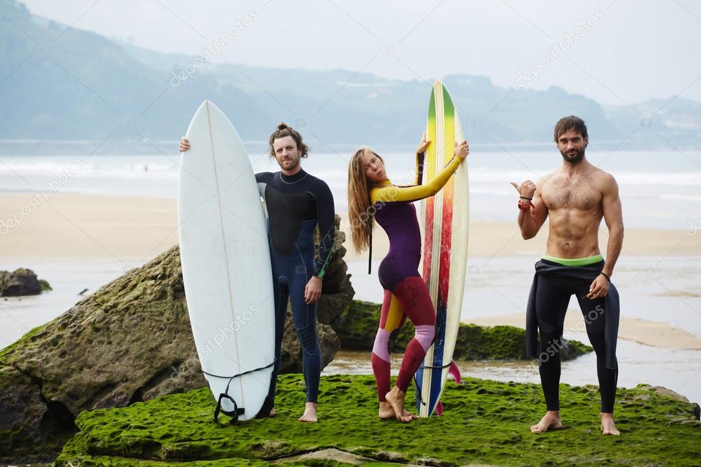 People having fun while waiting surfing