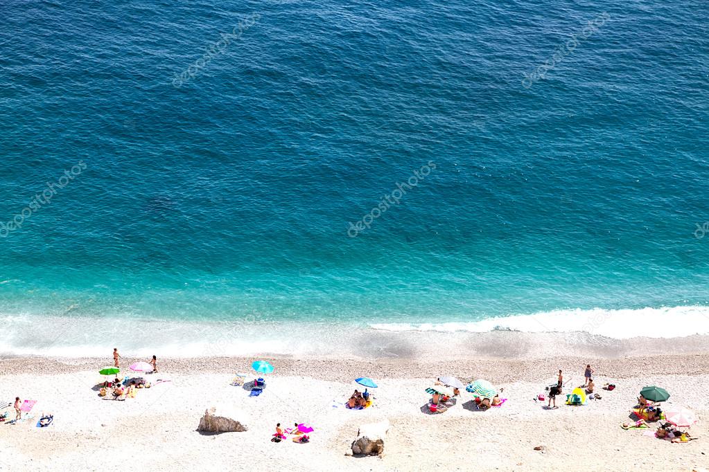 Beautiful seashore with sunbathe people