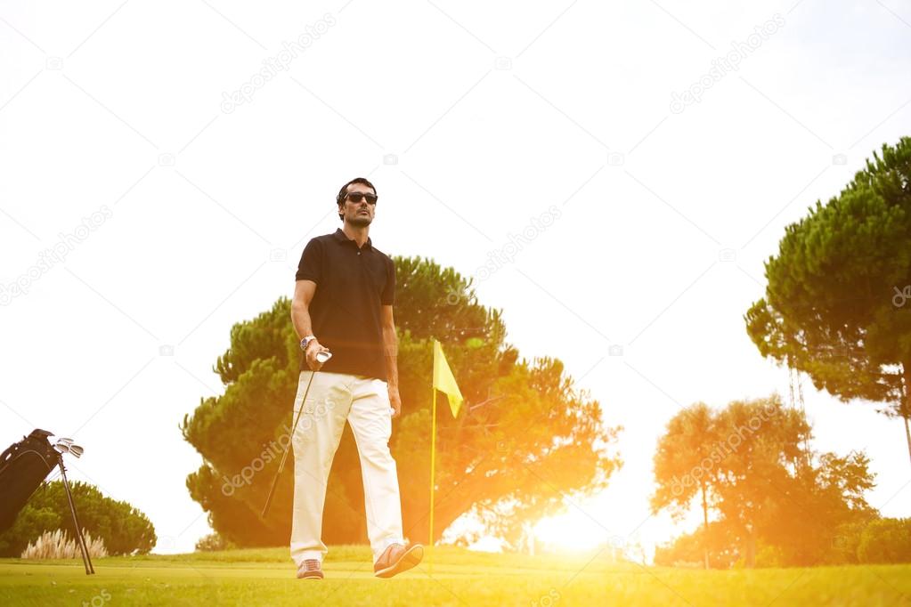Golf player walking to the next hole