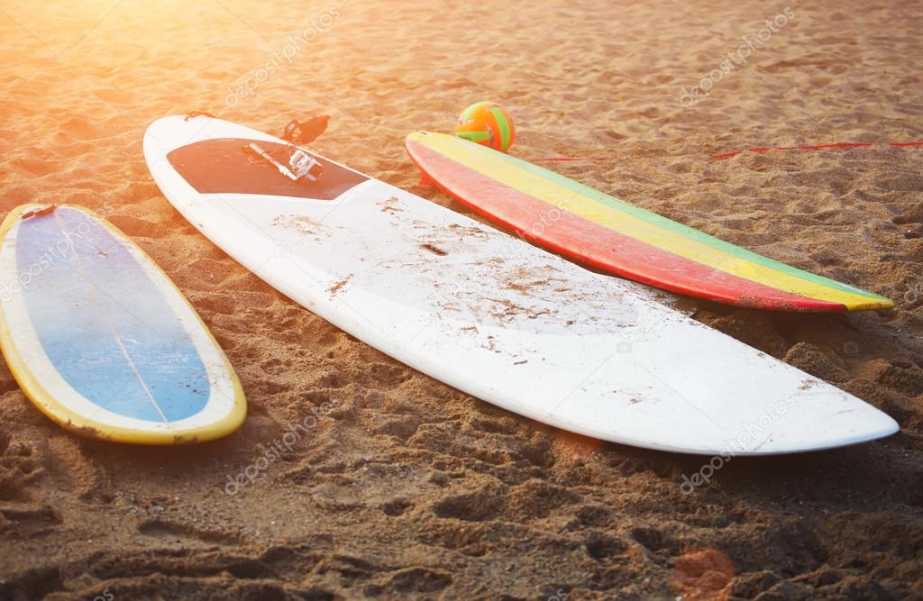 Surfboards lying on the beach