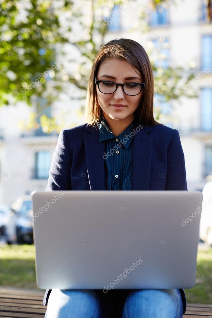 Student working on laptop at campus