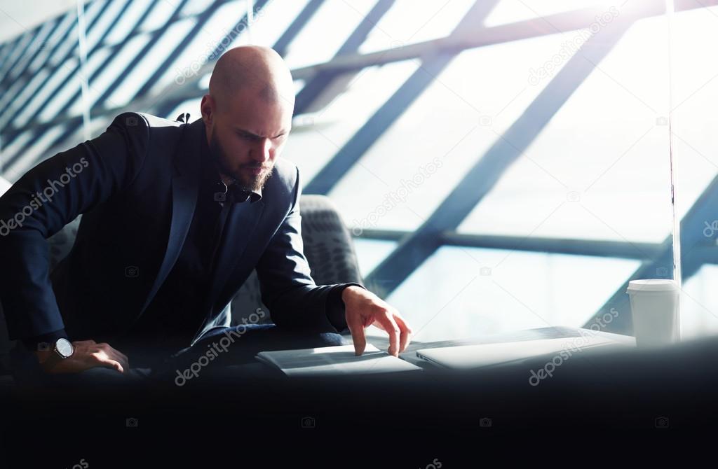 Male executive examining paperwork