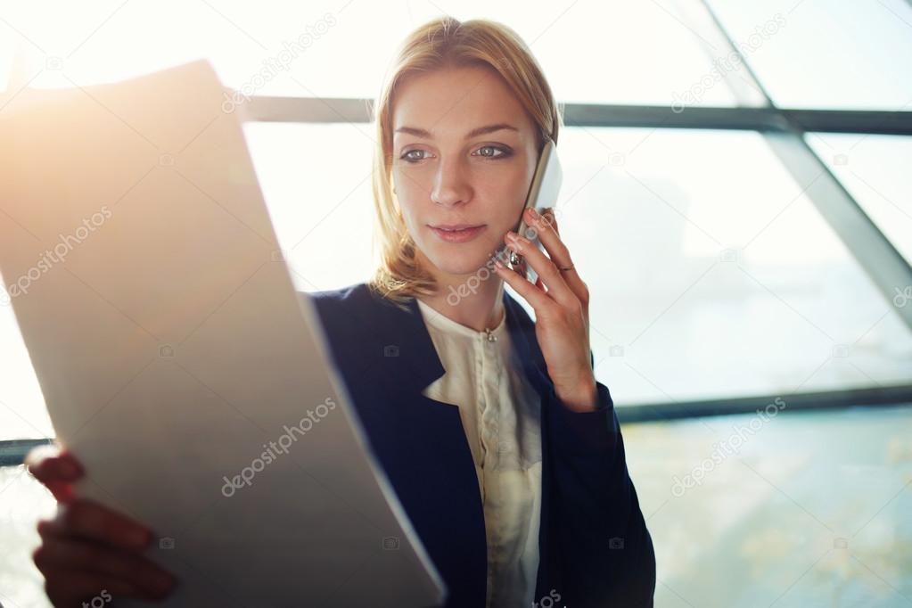 Business woman having cell phone conversation