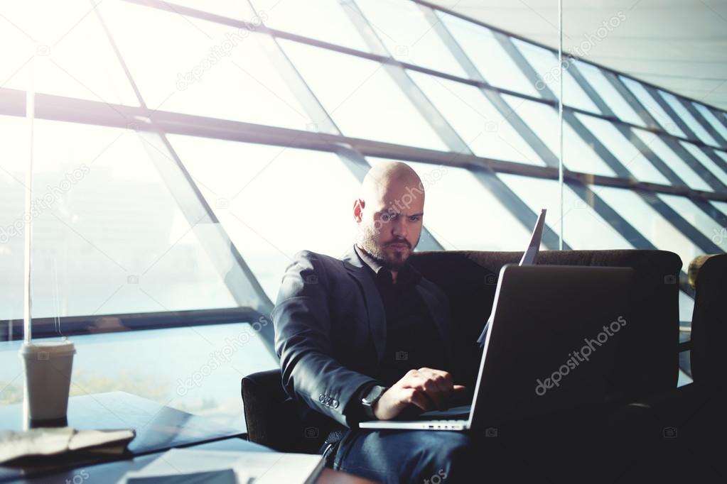 Businessman typing on computer keyboard