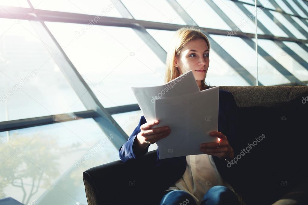 Business woman examining paperwork