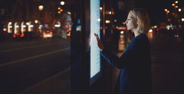 woman using modern urban application of bus stop clipart