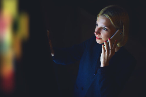 Woman  speaking on smartphone in city