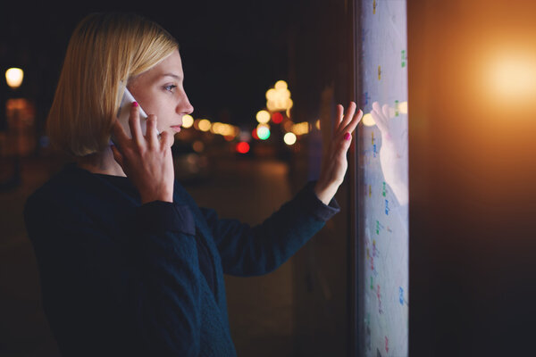 Woman  speaking on smartphone in city