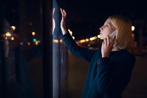 Woman  speaking on smartphone in city