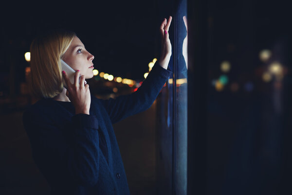 Woman  speaking on smartphone in city