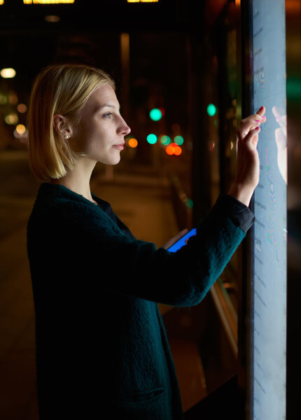 businesswoman touching sensitive screen