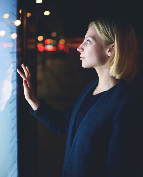 businesswoman touching sensitive screen