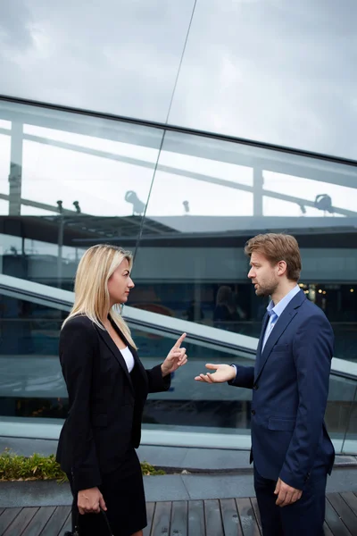 business colleagues discussing work during break