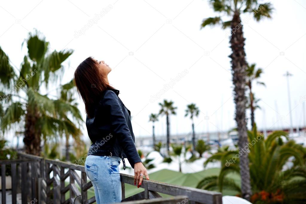 young woman breathing fresh air