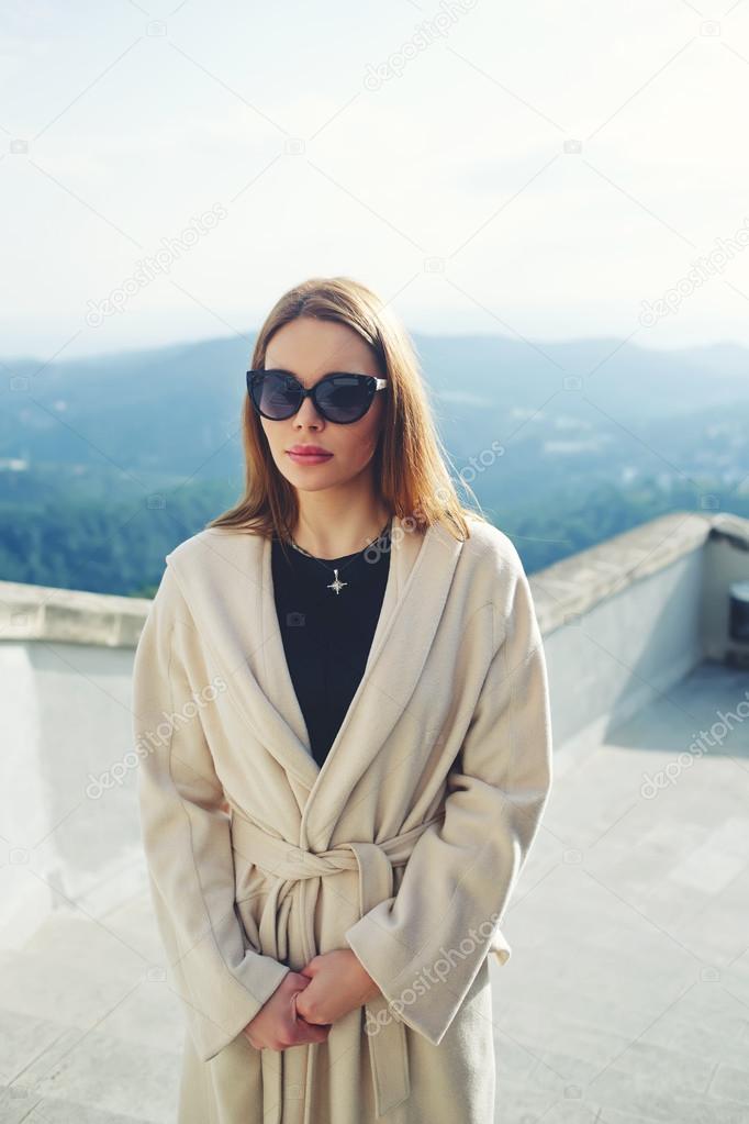 woman standing on beautiful mountains background