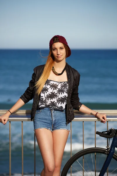 Stylish hipster girl standing on the pier — Stock Photo, Image