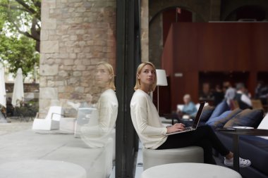 Female freelancer working on laptop computer