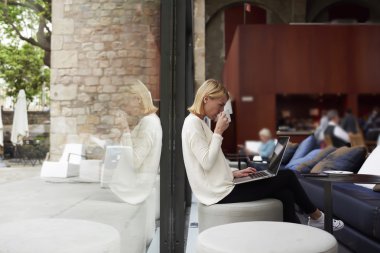 Female freelancer working on laptop computer