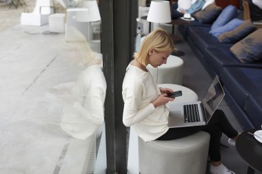 freelancer working on the distance in cafe