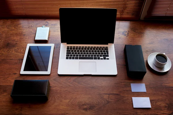 Open laptop computer and digital tablet with blank screen — Stok fotoğraf