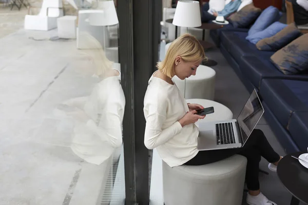 Freelancer working on the distance in cafe Stok Resim