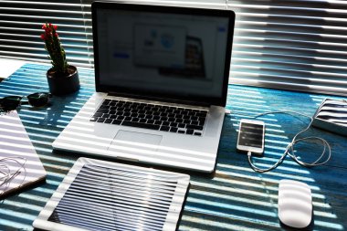 Modern freelance desktop with accessories and distance work tools