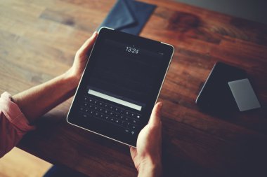 Hipster man hands holding digital tablet with empty blank screen for your text message