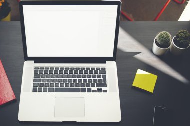 Freelancer workplace with stickers and phone