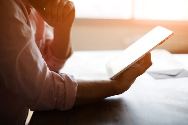 Experienced entrepreneur reading some text or electronic book at the office Stock Photo