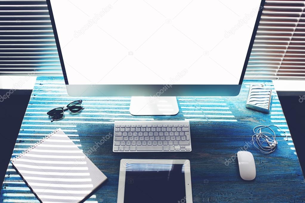 Mock up of office or home desktop with accessories and work tools, blank screen pc computer