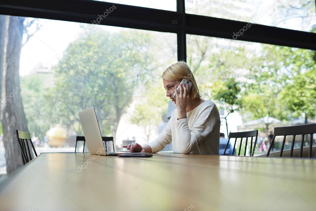 Caucasian student looking to net-book screen