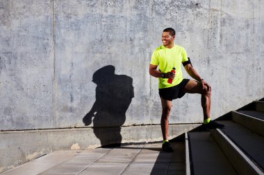 man jogger refreshing with energy drink