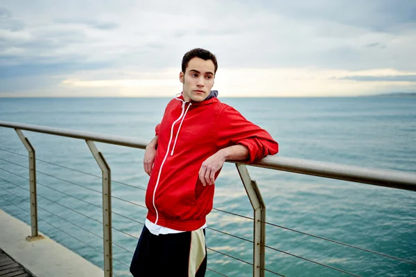 male runner taking break after run