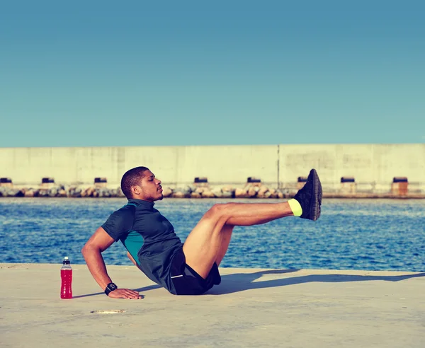 Man doing hard legs exercise — Stockfoto