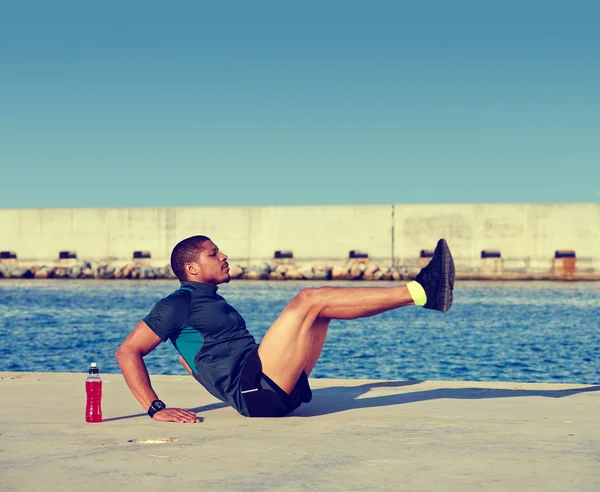 Man doing hard legs exercise — Zdjęcie stockowe