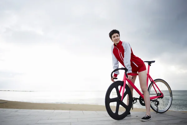 Portrait of young sporty female cyclist — Stockfoto