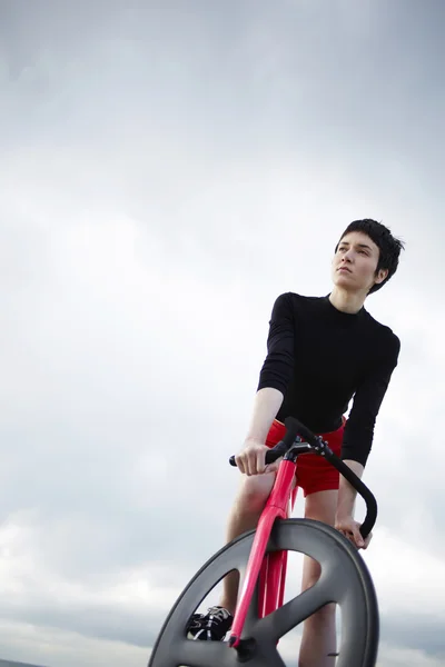 stylish woman standing with her bicycle