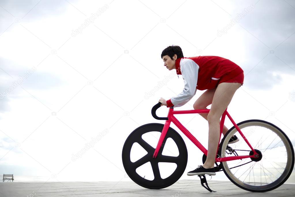 hipster girl riding on her bicycle