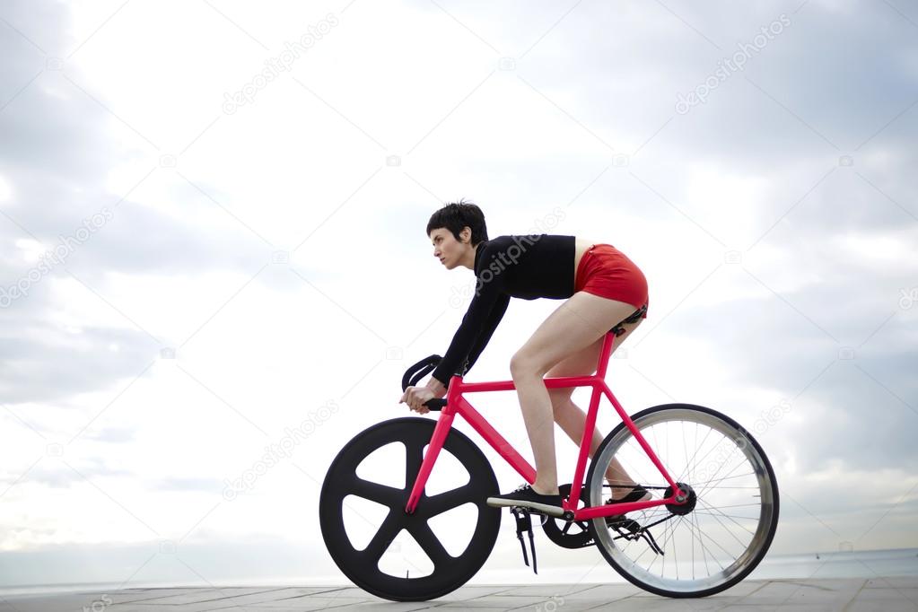 sporty woman enjoy ride on bicycle