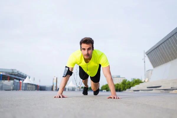 Handsome man doing exercises — Stock Photo, Image